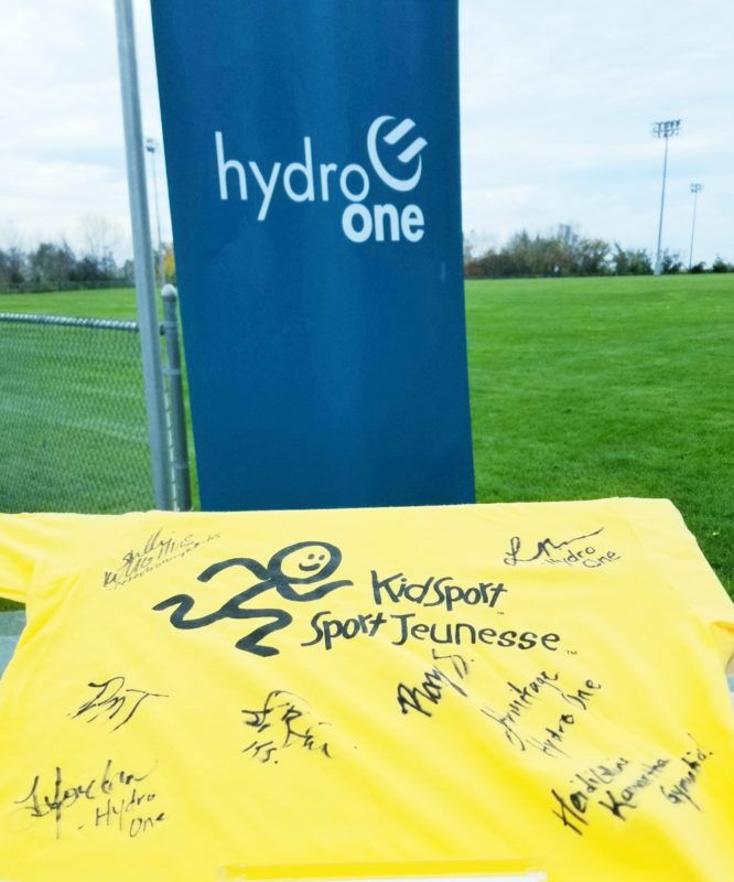 Hydro One banner and signed KidSport shirt